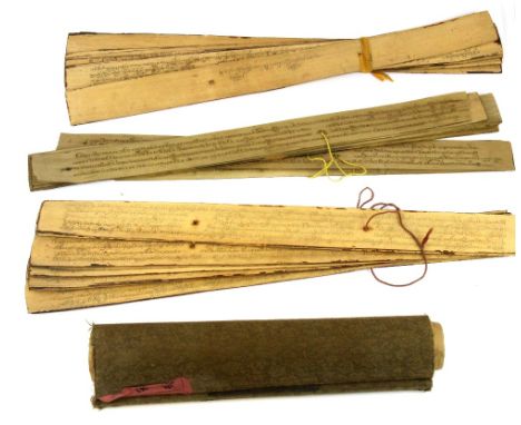 Two Mongolian Buddhist texts inked on reeds with a Chinese scroll.