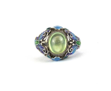A Chinese silver enamel and green hardstone adjustable ring.