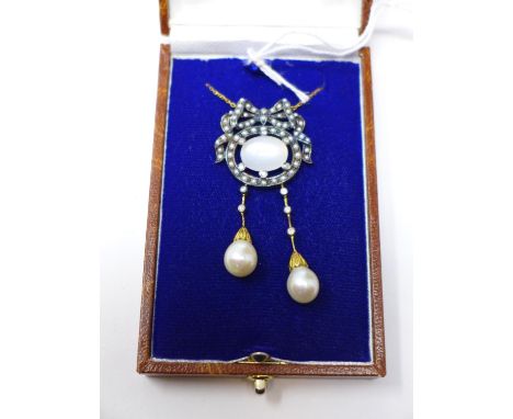 A boxed yellow gold necklace set with a central oval moonstone framed by pearls in a bow and ribbon surroundto diamond and pe