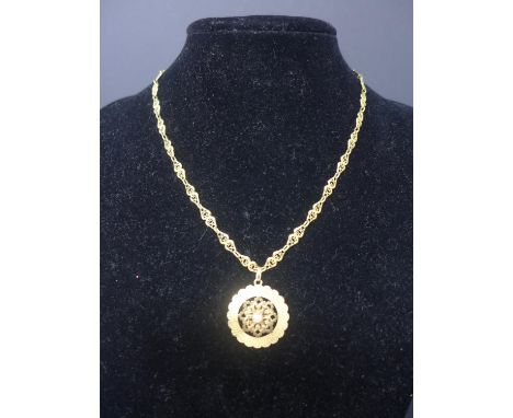 A high carat yellow gold and pearl circular pendnat on a high carat yellow gold filigree-linked chain, L: 46cm, 11.7g 