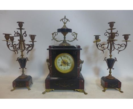 A French black slate and variegated marble clock garniture, the Arabic dial signed Fouilleul Avranches, with urn finial and b