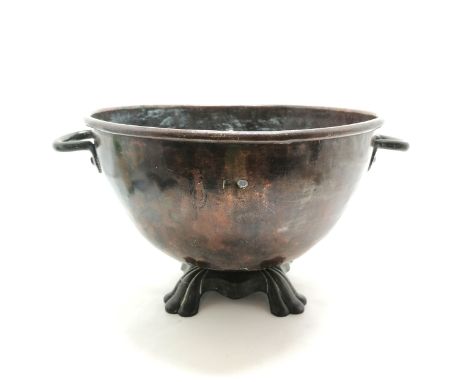 Anjtique copper coal bin / planter with 2 handles on cast metal base - 43cm diameter and has 2 drilled holes to the body