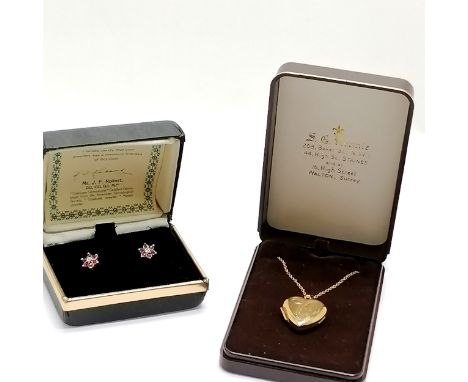 9ct hallmarked gold heart shaped locket on a gold plated 44cm chain t/w pair of boxed 9ct gold ruby / white stone set earring