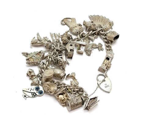 Silver charm bracelet with charms inc Chim lion, grandfather clock with moveable mouse, cheese with enamel mouse, 800 silver 
