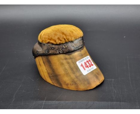 Taxidermy: an electroplate mounted hoof pincushion, inscribed 'Topsy', 12cm long.
