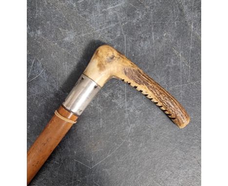 An antler handled silver mounted riding crop. 
