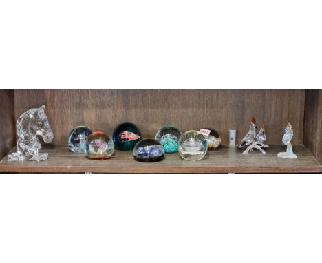 A Waterford glass horse's head, 12.5cm high; together with a Baccarat crystal group of two doves; seven glass paperweights; a