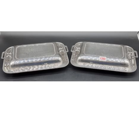A pair of electroplated entree dishes and covers, by Asprey, 31.5cm wide.