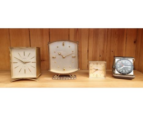 Two vintage Smiths brass timepieces, largest 15cm high; together with a Cyma Amic alarm clock, 6cm high; and another vintage 