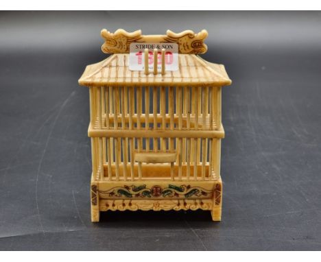 A Chinese carved bone cricket cage, 12.5cm high.