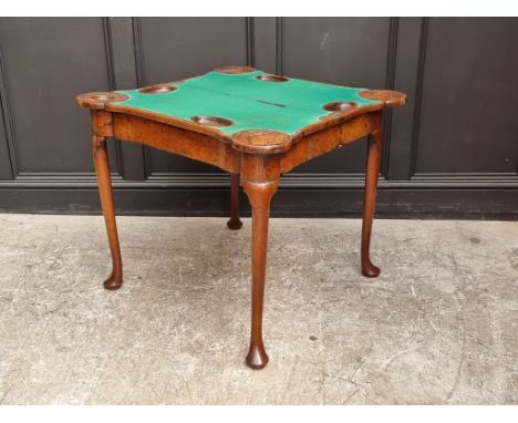 An 18th century figured walnut, feather and crossbanded concertina card table, with counter wells and outset corners, 84.5cm 