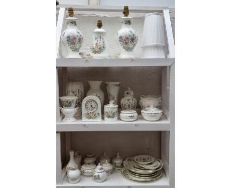 A large collection of Aynsley 'Wild Flower' pattern items, to include table lamps. (three shelves)