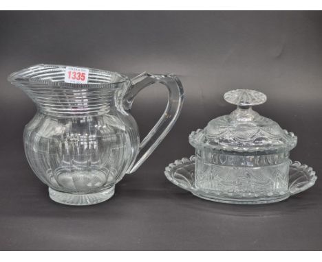 A late 18th century Waterford tureen, cover and stand, 20.5cm wide; together with a similar early 19th century jug, 17cm high