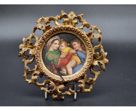 After Raphael Sanzio, 'Madonna Della Sedia', on porcelain, 11.7cm diameter, in a Florentine style giltwood frame.