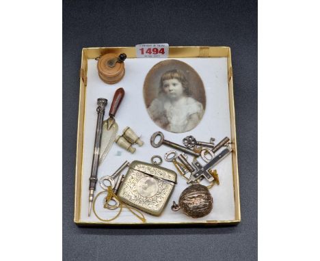 A mixed lot of works of art, to include a boxwood tape measure; a propelling pencil; a portrait miniature on opaque glass, et
