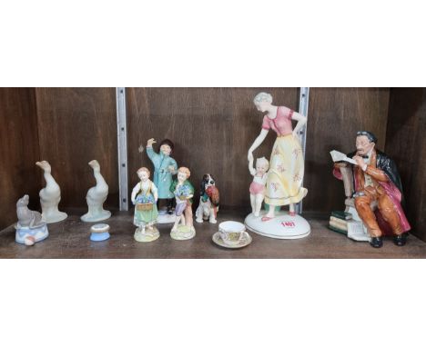 A Katzhutte pottery figure group, 25cm high; together with a Royal Doulton figure; a Royal Doulton Spaniel; a Royal Worcester