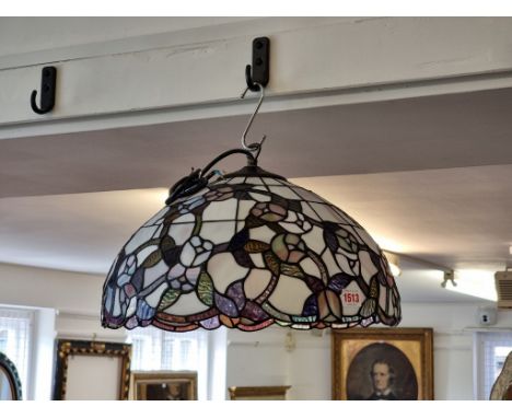Two Tiffany style stained and leaded glass ceiling lights, largest 43.5cm diameter. (2)