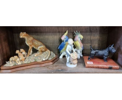 A Border Fine Arts figure group of cheetahs, on mahogany stand, 34.5cm wide; together with a pair of Carl Ens cockatoos, 19.5