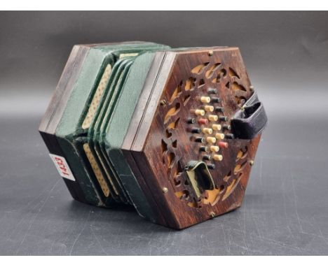An antique rosewood concertina, numbered 24814.