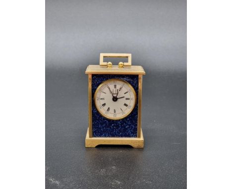 A small Dunhill simulated lapis and brass carriage clock, with alarm, height including handle 10cm.