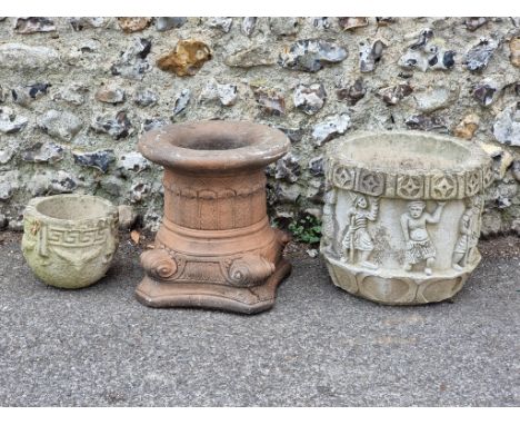 A composition stone Corinthian capital, 39cm high; together with another composition stone jardiniere, 35.5cm high; and anoth