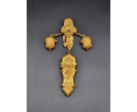 An antique Continental gilt metal chatelaine, with attached etui, incorporating an ivory implement, (lacking two items), 20cm