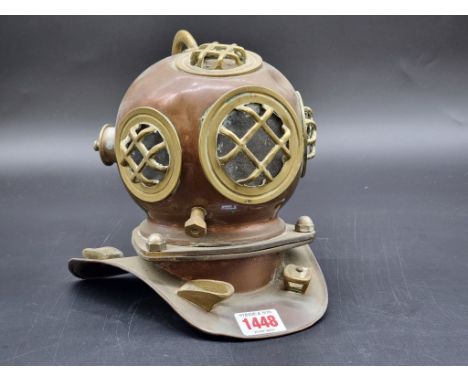 A miniature copper and brass novelty diver's helmet, 20cm high.