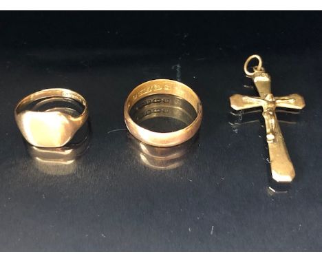 Three items of 9ct Gold jewellery to include a cross/ crucifix pendant and a child's signet ring (3) total weight approx 5.4g