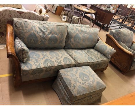 Modern furniture, long 2 seater sofa in a colonial style wooden frame with scroll arms and woven rattan inserts, the cushions