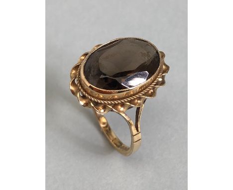 9ct Gold ring set with a smokey Quartz gemstone approx 13mm x 9mm and size 'L'