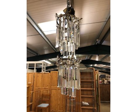 Antique lighting, a pair of late 19th century glass 2 tier prism chandeliers , elongated drops suspended from 2 gilt gallery'