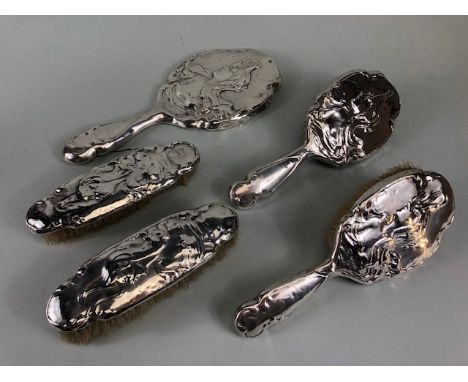 Antique Silver, collection of Silver backed art nouveau design hair brushes and a hand mirror Birmingham 1906 and 1903 all A.