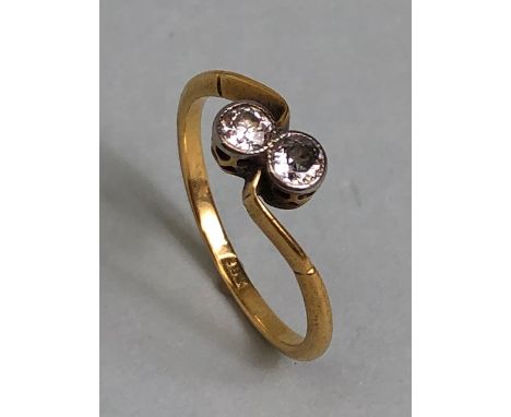 Antique 18ct yellow gold ring mounted with 2 diamonds in a cross over design, approximately K 1/2 and 1.77g Inclusive 