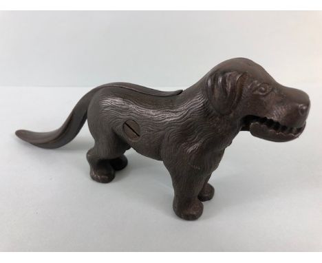 Antique cast Iron dog nut cracker, the tail leaver stamped Made in England along with an illegible registration number, appro