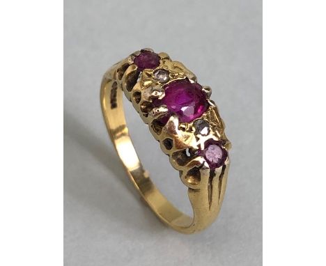 18ct Gold ring set with red/pink gemstones size approx 'L' & 3.7g