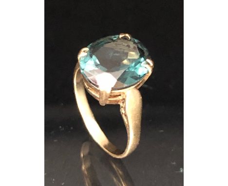 9ct Gold ring set with a synthetic translucent Green gemstone in a four claw setting, size approx 'L' and 3.1g