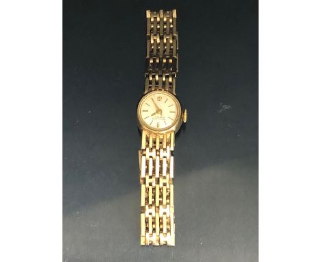 9ct Gold Ladies wristwatch with 9ct Gold gate link bracelet strap, the watch face marked 17 RUBIS ANTICHOC (total weight appr
