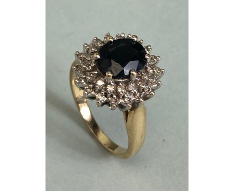 9ct Gold Sapphire and Diamond cluster ring the central faceted Sapphire approx 7.5 x 9mm and size 'N' 