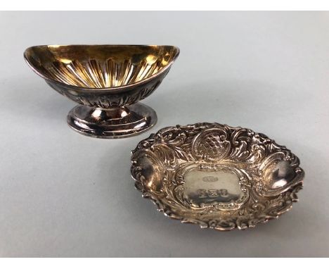 Two hallmarked silver salts one on a pedestal base with gold gilt interior the other on a flat base by maker W I Broadway &am