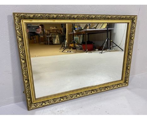 Mirror, modern mirror in a Gilt frame of leaf and berry design approximately 86 x 61cm