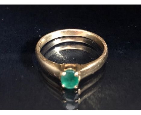 18ct yellow Gold ring set with a single faceted Emerald in a four claw setting. The Emerald approx 5.9 x 4.55mm, ring total w