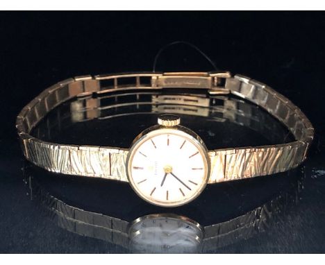 9ct yellow gold ladies Tissot watch on 9ct tapered bark finish bracelet  approximately 14.98g total, winds and runs