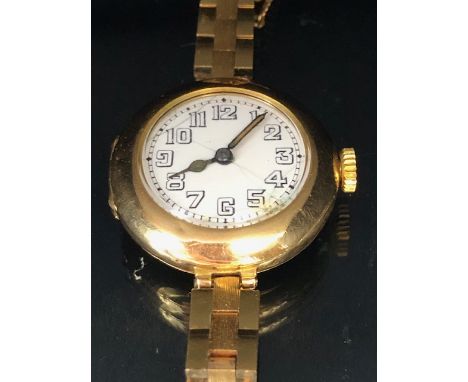 Rolex watch, early 20th century ladies 15ct gold Rolex watch, round white ceramic face with Arabic numerals, Rolex Number 639