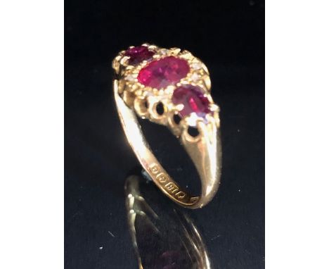 18ct Gold ring set with diamonds and red/ pink gemstones size 'O' and 3g