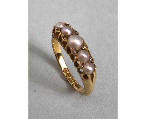 18ct Gold ring set with five graduated pearls and divided by pairs of small diamonds size approx 'M' &amp; 4.5g