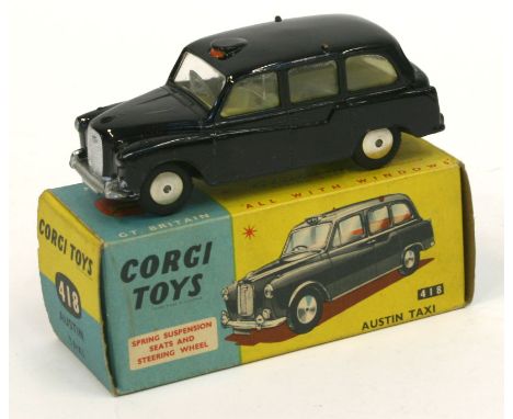 Corgi Toys 418 Austin London Taxi Cab,black body, lemon interior, spun hubs, in near mint condition, with a excellent box and