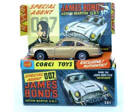 Corgi Toys 261 James Bond Aston Martin from the Film “Goldfinger” gold body, with ejector seat, rear bullet screen, retractab