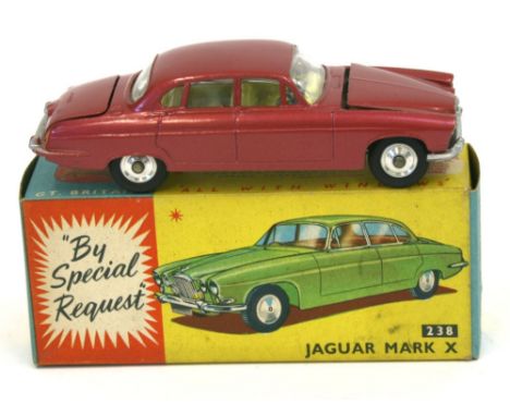 Corgi Toys 238 Jaguar Mark X,metallic cerise, lemon interior, spun hubs,luggage in boot, in near mint condition, a couple of 