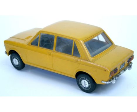 Scarce Pocher (Torino Italy) Promo Model Fiat 128 ,orange plastic body ,battery operated, working in good condition, some wea