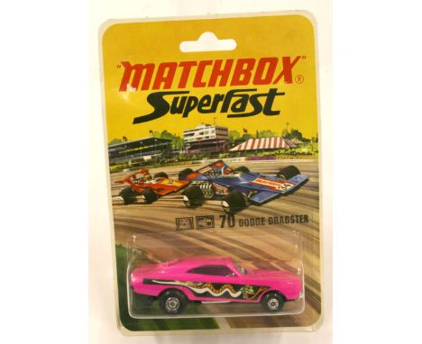 Matchbox Superfast 70b Dodge Dragster in early 1970s blisterpack, purple body and black base, model is mint in mint sealed pa